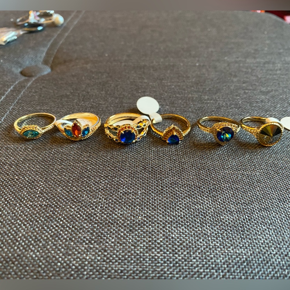 5/$15 Bundle of 10 rings and a small pack of teacher themed charms.